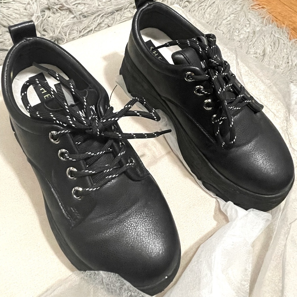 Black platform sneakers